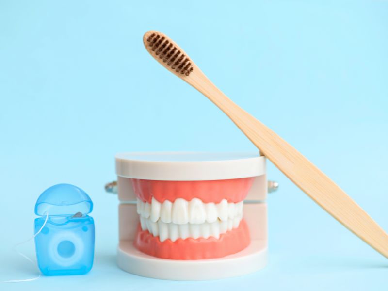 diferença entre dentadura fixa e implante